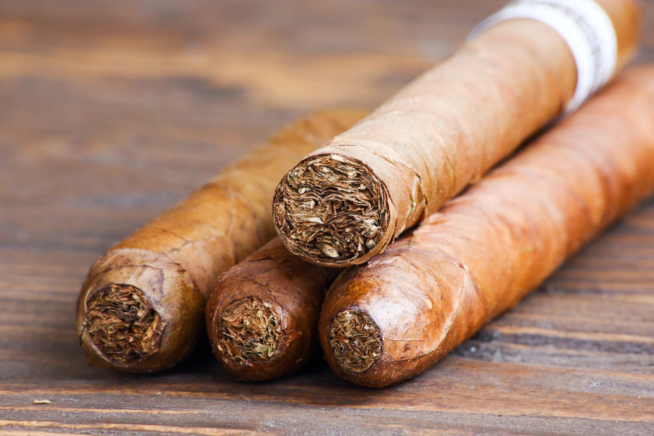 Premium cigars displayed on a wooden table