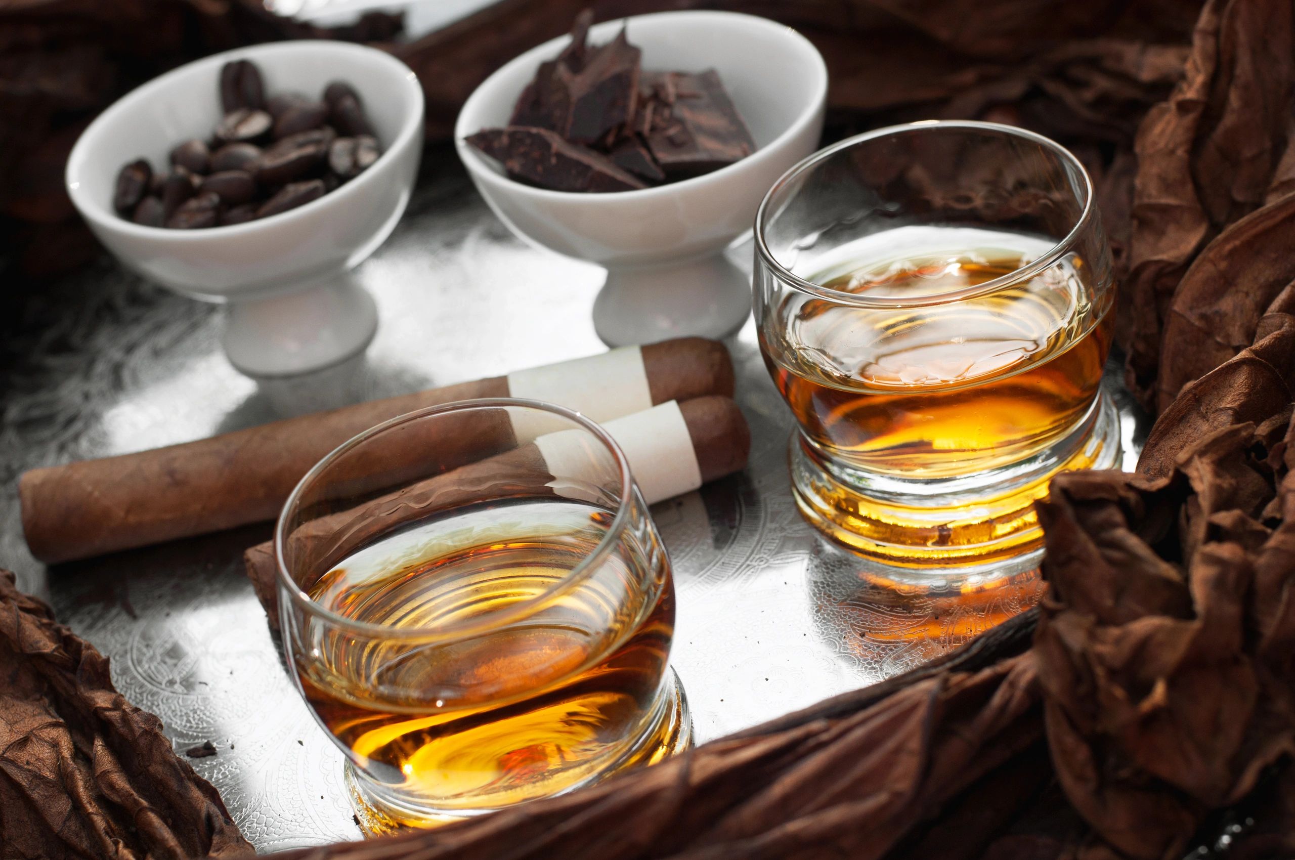 Premium cigars with tasting accessories on an elegant tray